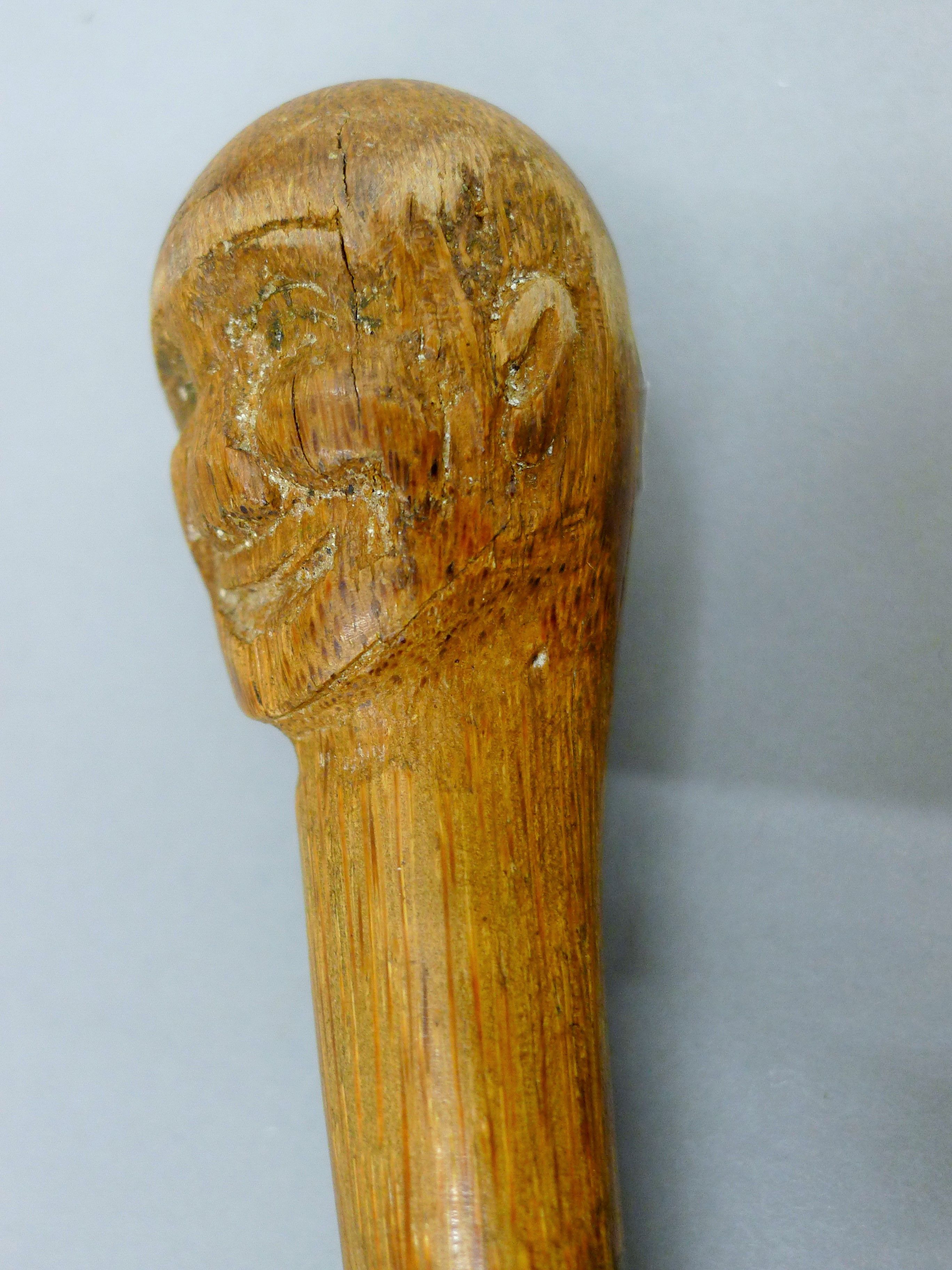 A carved man's head form stick - Image 3 of 3
