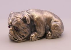 A silver model of a dog bearing Russian marks. 6.5 cm long. 60.4 grammes total weight.