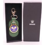 A boxed Rolex Wimbledon key ring.