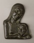 A patinated bronze wall plaque modelled as The Madonna and Child, indistinctly monogrammed.