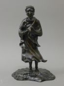 A Meiji period Japanese bronze model of a deity. 22 cm high.