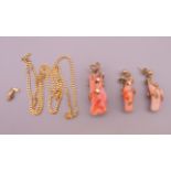 A coral pendant and matching earrings, and a 9 ct gold chain. The pendant 4.25 cm high.
