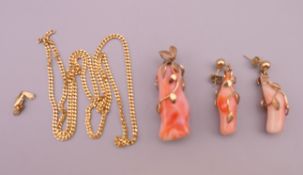 A coral pendant and matching earrings, and a 9 ct gold chain. The pendant 4.25 cm high.