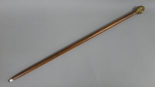 A four faced buddha handled walking stick. 92 cm long.