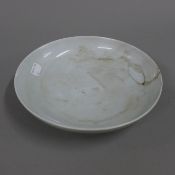 A Chinese celadon dish. 22.5 cm diameter.