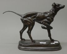 A bronze model of a dog. 39 cm long.