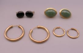 Four pairs of various earrings.