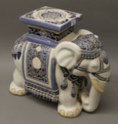 A porcelain elephant form stool. 42.5 cm high.