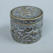 A Chinese embossed silver box. 6.5 cm high. 145.3 grammes.