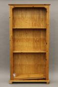 A modern pine bookcase. 95 cm wide x 184 cm high.