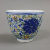 A Chinese Ducai porcelain tea bowl. 6 cm high.