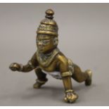 An antique bronze model of Krishna, with hinged lid. 7 cm high.