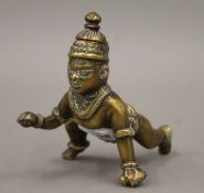 An antique bronze model of Krishna, with hinged lid. 7 cm high.