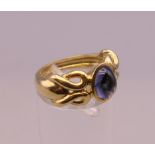 A 10 K gold cabochon ring. Ring size L. 7.4 grammes total weight.