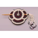 A Native American bead work hair clip. 9 cm wide.