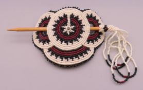 A Native American bead work hair clip. 9 cm wide.