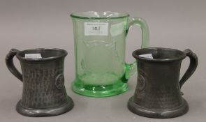 Three 1937 Coronation tankards, two pewter and one glass. The latter 10.5 cm high.