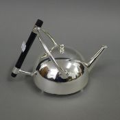 A Christopher Dresser style silver plated tea pot. 14 cm high.