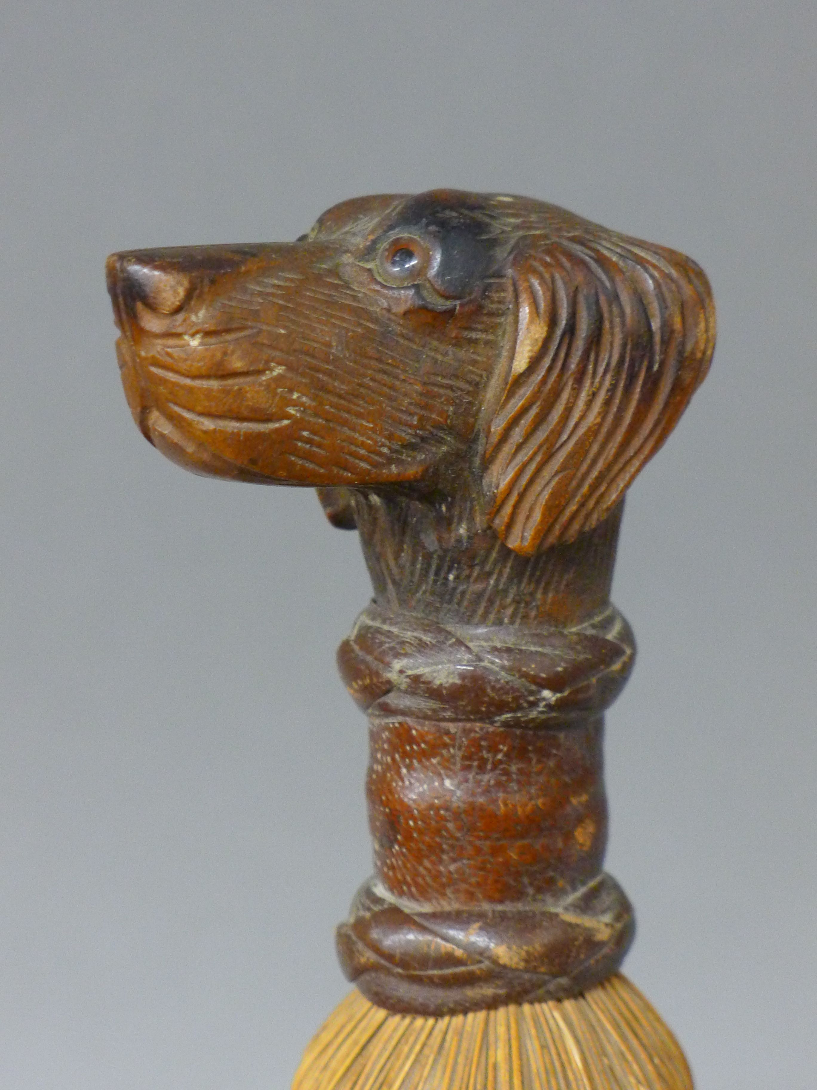 A brush mounted with a carved wooden dog's head handle. 27.5 cm high. - Image 2 of 4