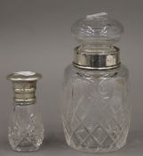 Two silver mounted cut glass jars. The largest 15 cm high.