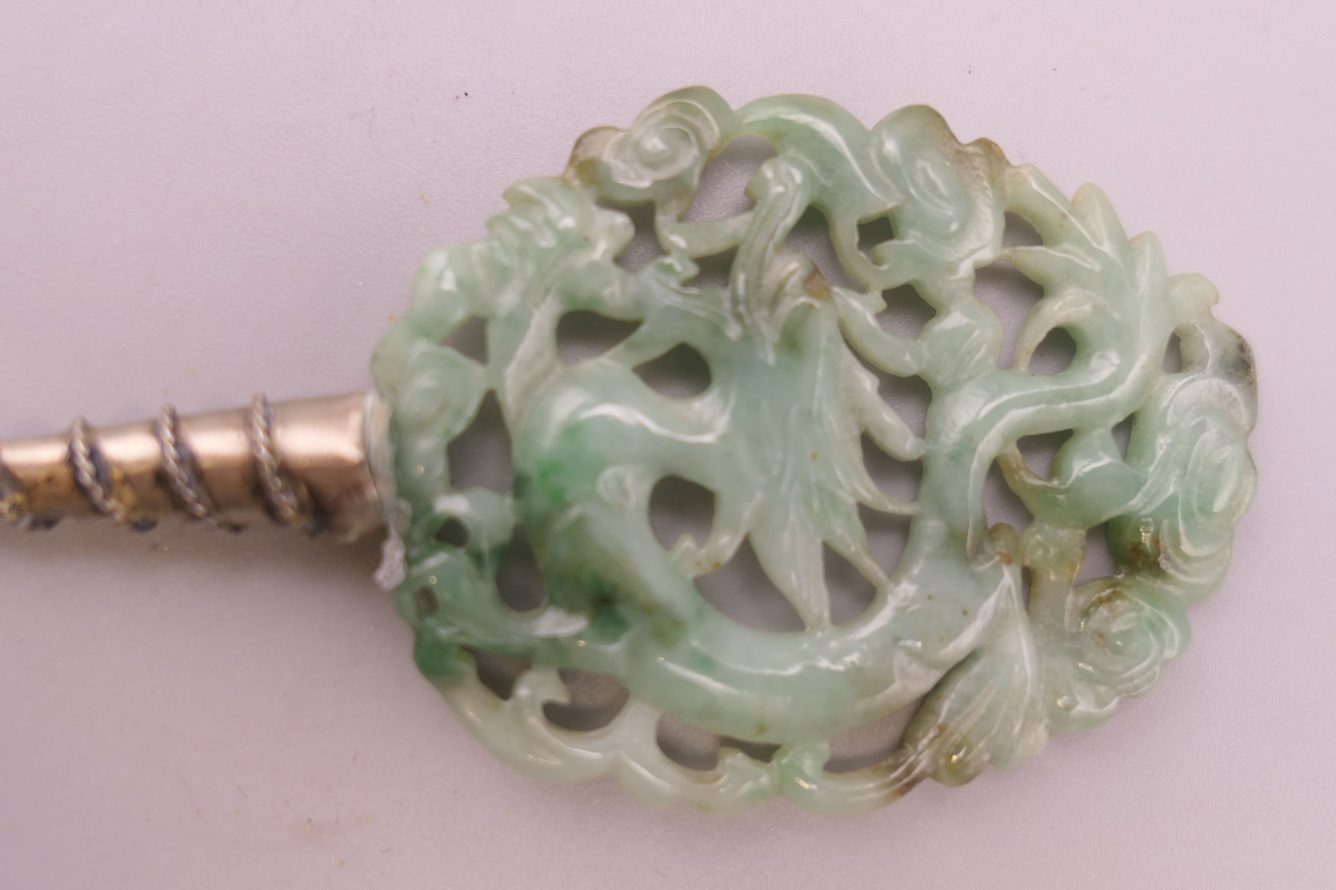 A 19th century Chinese apple green reticulated jade and silver hairpin formed as a dragon. 17. - Image 2 of 3