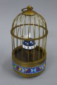 A cloisonne birdcage clock. 18 cm high.