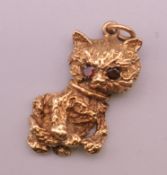 A 9 ct gold charm formed as a kitten. 2.5 cm high. 3.6 grammes total weight.