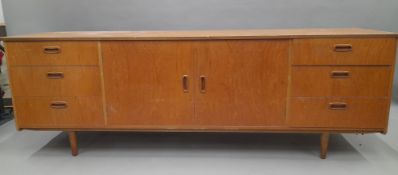 A mid-20th century side board. 182 cm long.