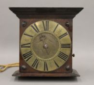 A 19th century oak cased hanging clock. 29 cm high.