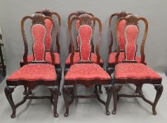 A set of six early 20th century Queen Anne style mahogany dining chairs. 56 cm wide.