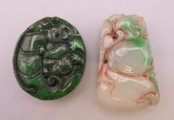 Two jade pendants. The largest 5.5 cm high.