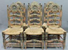 A set of six 19th century Spanish rush seated painted ladder back chairs. 53 cm wide.