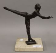 A bronze model of an ice skater, signed S.