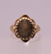 A 9 ct gold ring. Ring size O/P. 3.3 grammes total weight.