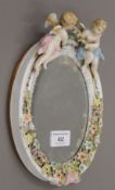 A Continental porcelain mirror. 24 cm high.