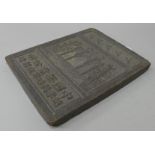 A Chinese tea brick. 18.5 cm x 23.5 cm.