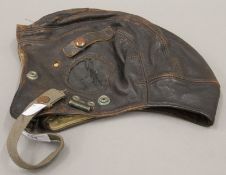 A vintage leather flying helmet.