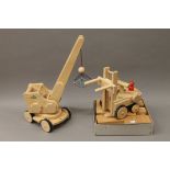 Two boxed Nic wooden toys, a crane and a fork lift, and a set of wooden building blocks.