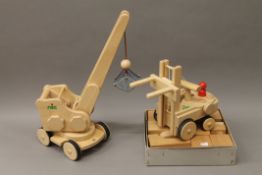 Two boxed Nic wooden toys, a crane and a fork lift, and a set of wooden building blocks.