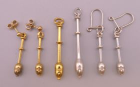 A silver gilt pendant and earrings each formed as a lace bobbin together with a silver set.