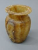 An alabaster vase. 14.5 cm high.