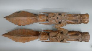 A pair of Asian figural wooden carvings. 104 cm high.