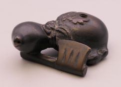 A Chinese bronze gourd form water dropper. 6.5 cm long.