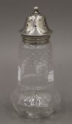 A cut glass silver top sugar sifter by George Unite, Birmingham 1902. 17 cm high.