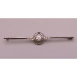 An unmarked white gold or platinum diamond bar brooch. 6.5 cm long. 3.8 grammes total weight.