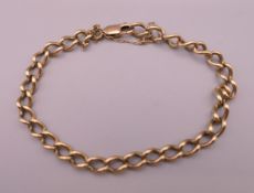 A 9 K gold bracelet. 12.8 grammes. Approximately 19 cm long.