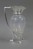 A Christopher Dresser style claret jug. 25.5 cm high.