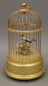 A Swiss Reuge music bird cage automaton music box. 29 cm high.