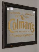 A framed mirror inscribed Colman's. 58 cm wide overall.