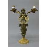 A 19th century bronze twin branch candelabra formed as a cherub. 38 cm high.